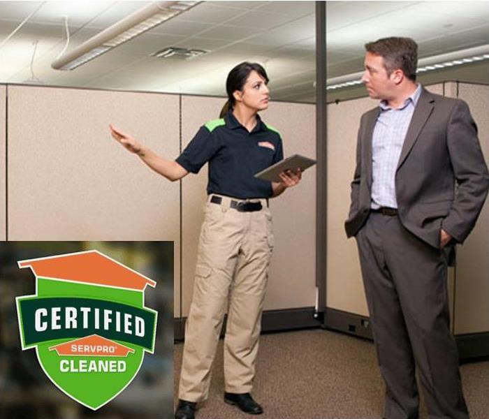 Certified: SERVPRO Cleaned - employee and customer talking